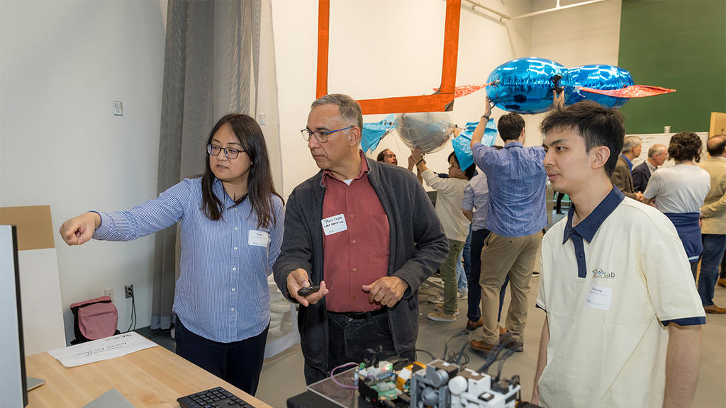 George Mason professors operate a switchboard for the autonomous balloon